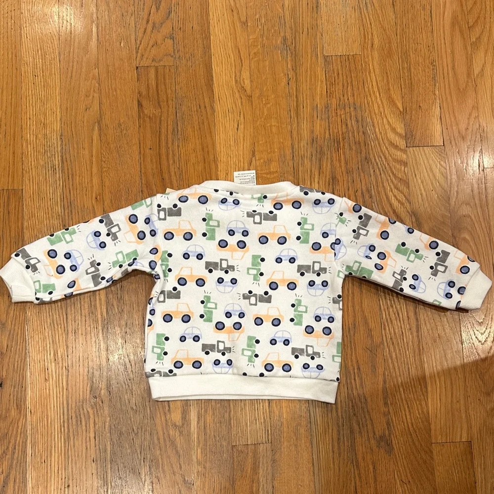 NWT. First Impressions White Sweatshirt with Colorful‎ Vehicle Print 12 months